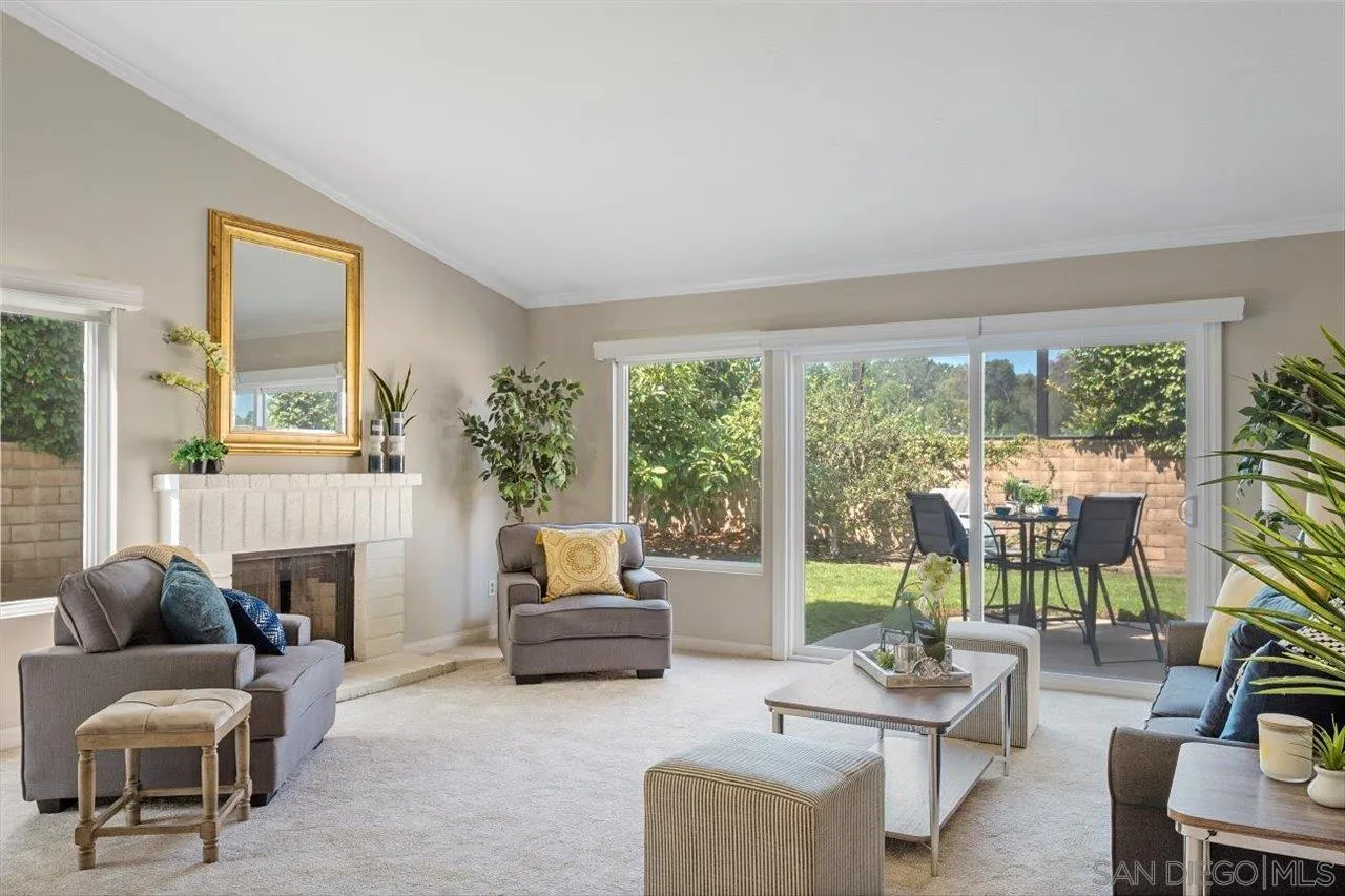 3355 Lower Ridge Road San Diego, CA 92130 - Photo 11 of 31 a living room with furniture and a floor to ceiling window