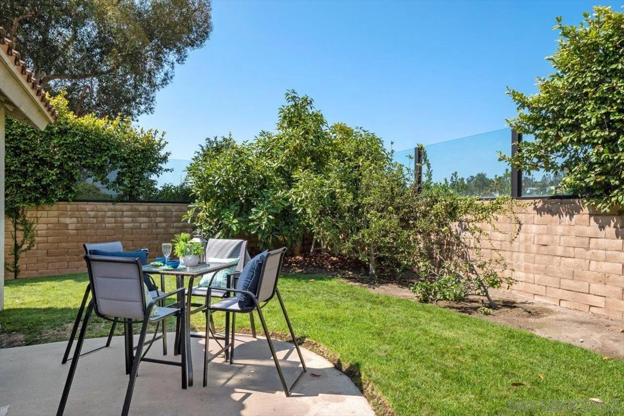 3355 Lower Ridge Road San Diego, CA 92130 - Photo 14 of 31 a view of chair and table in the garden