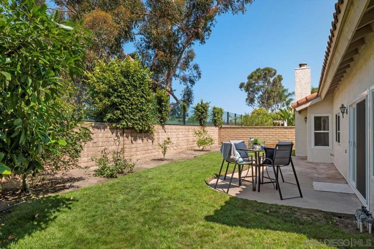 3355 Lower Ridge Road San Diego, CA 92130 - Photo 15 of 31 a patio with table and chairs and potted plants
