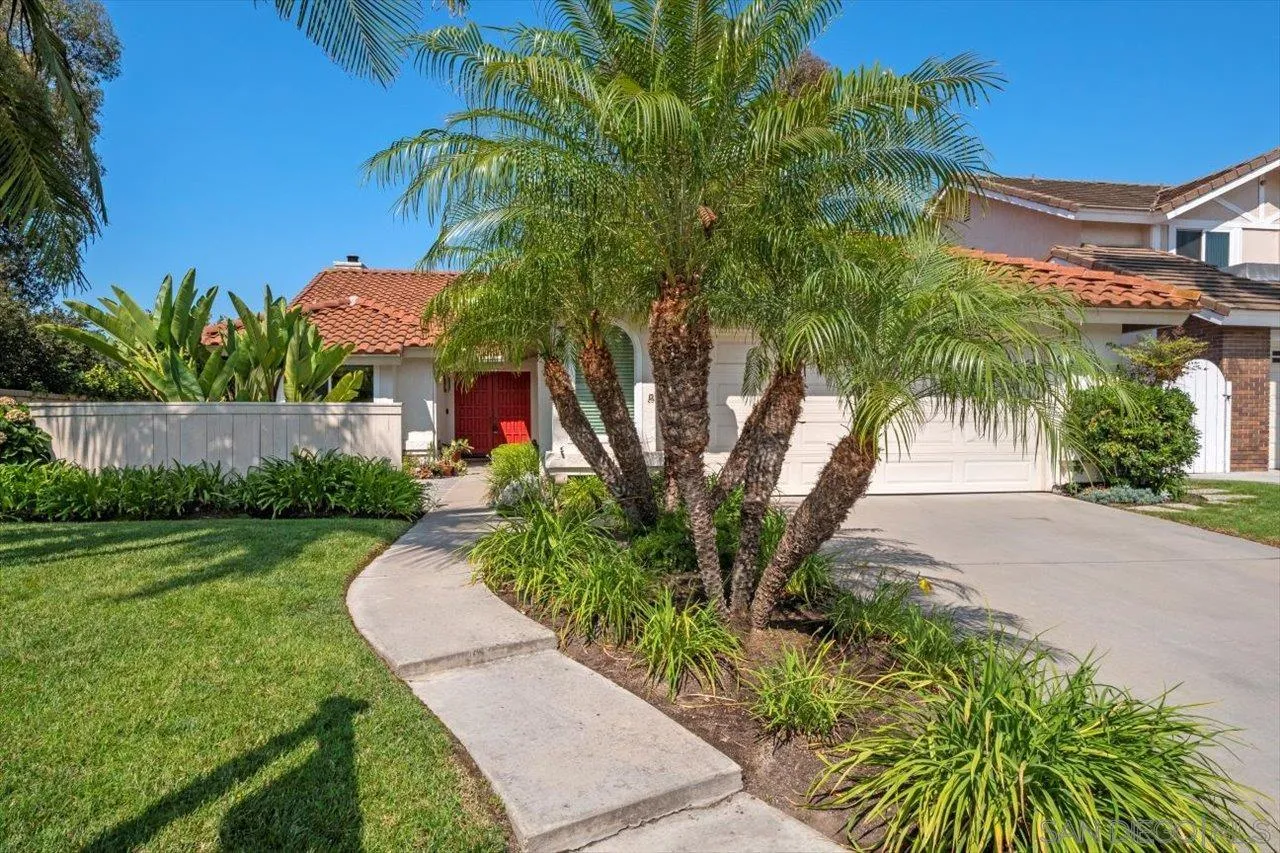 3355 Lower Ridge Road San Diego, CA 92130 - Photo 2 of 31 a front view of a house with a yard