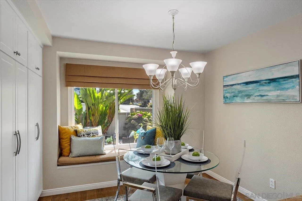 3355 Lower Ridge Road San Diego, CA 92130 - Photo 7 of 31 a dining room with furniture a livingroom and chandelier
