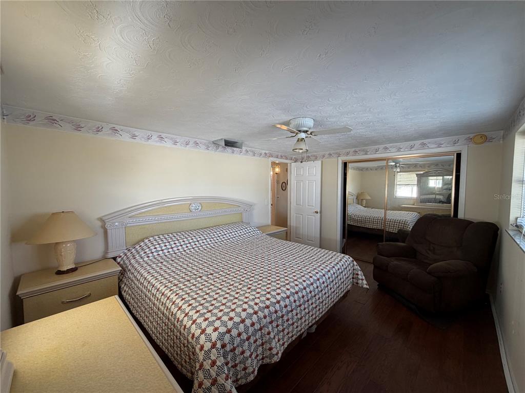 3914 Carioca Road Holiday, FL 34691 - Photo 18 of 23 a bedroom with a bed and window