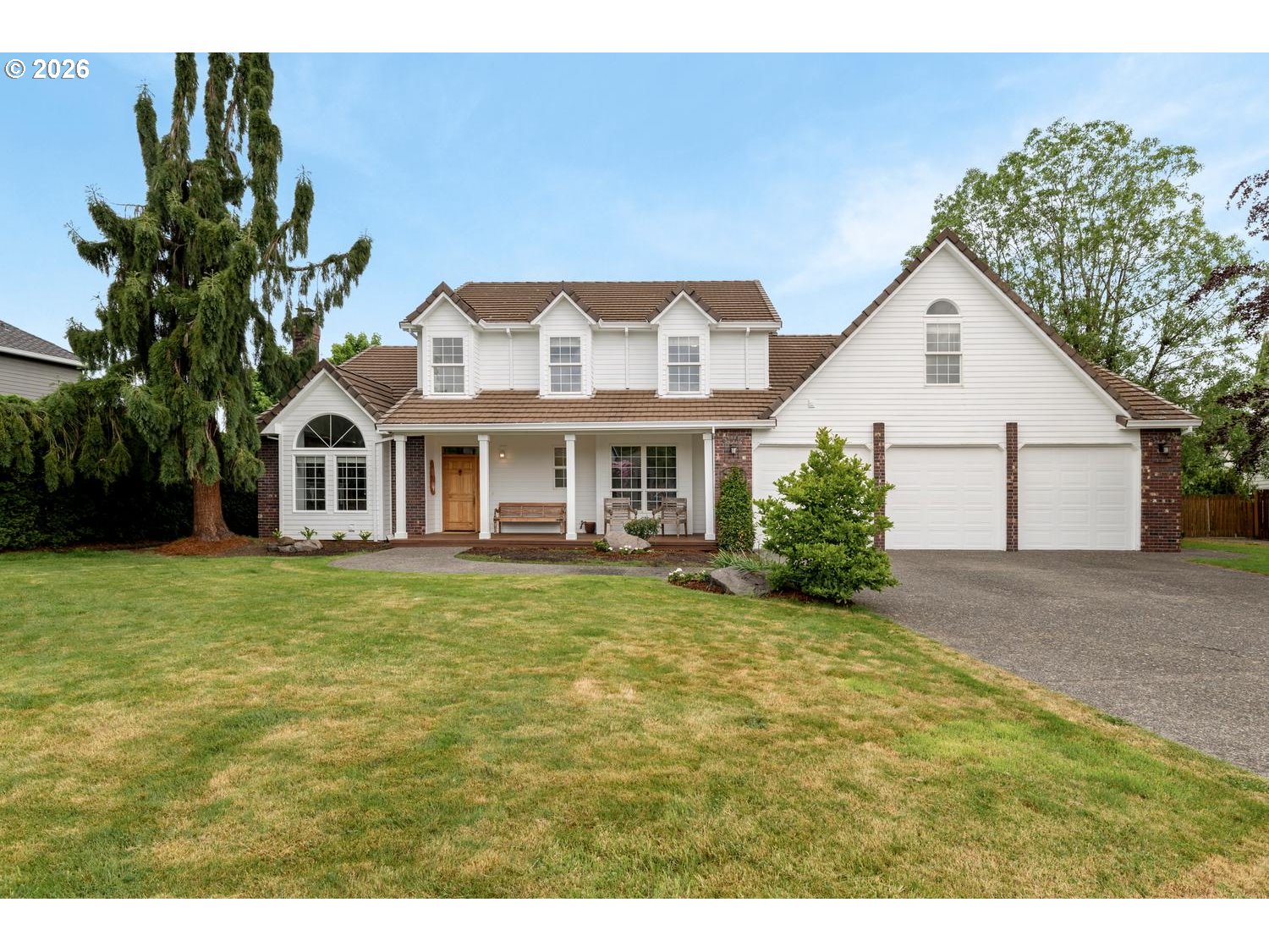 2519 Northwest 24th Circle Camas, WA 98607 - Photo 1 of 48 a front view of a house with a garden