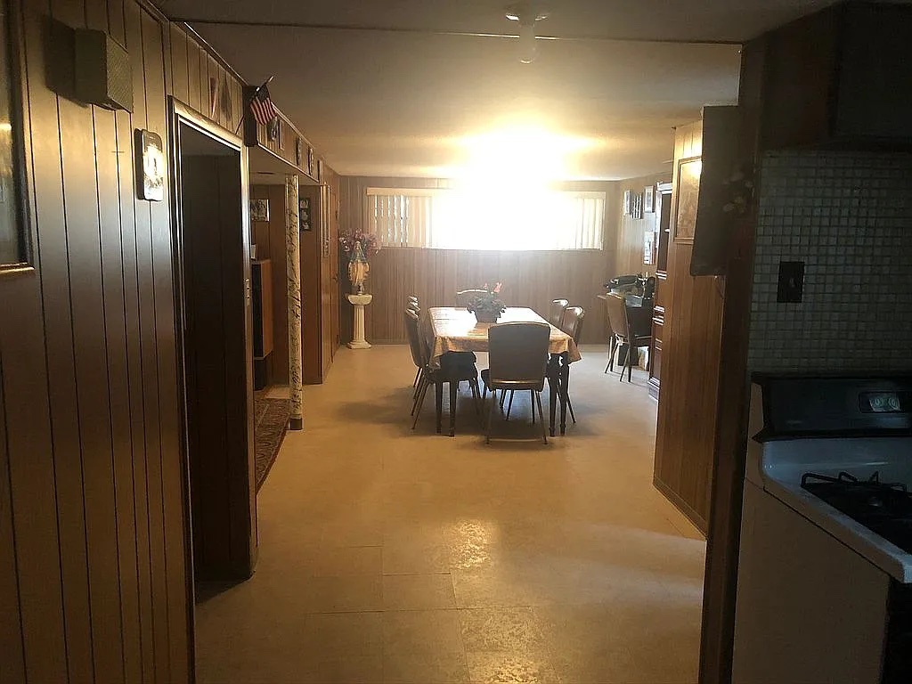 1342 Clinton Avenue Berwyn, IL 60402 - Photo 14 of 16 a dining room with furniture and a chandelier