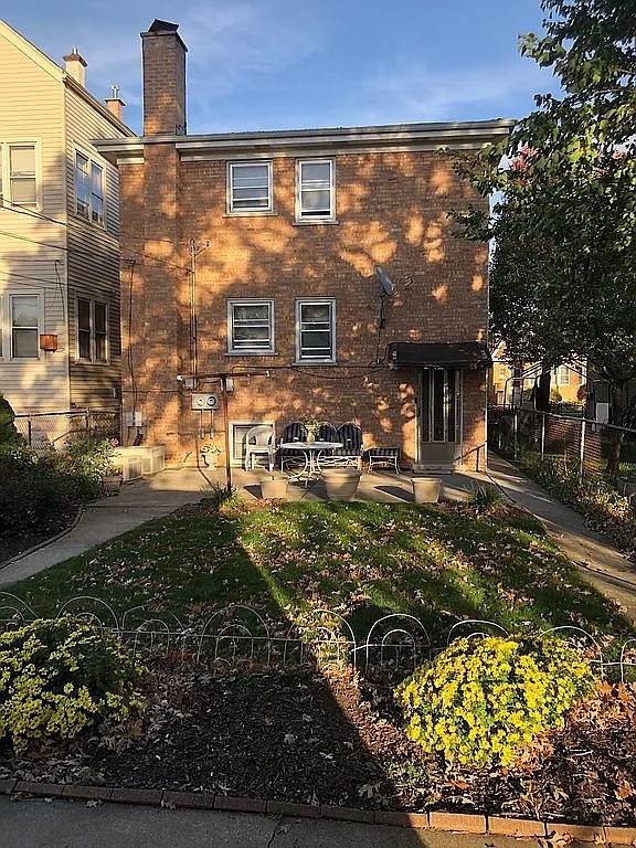 1342 Clinton Avenue Berwyn, IL 60402 - Photo 2 of 16 a front view of a house with a yard