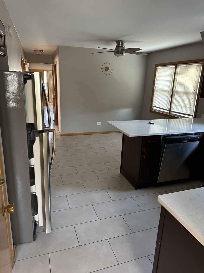 1342 Clinton Avenue Berwyn, IL 60402 - Photo 10 of 16 a view of cabinets and refrigerator