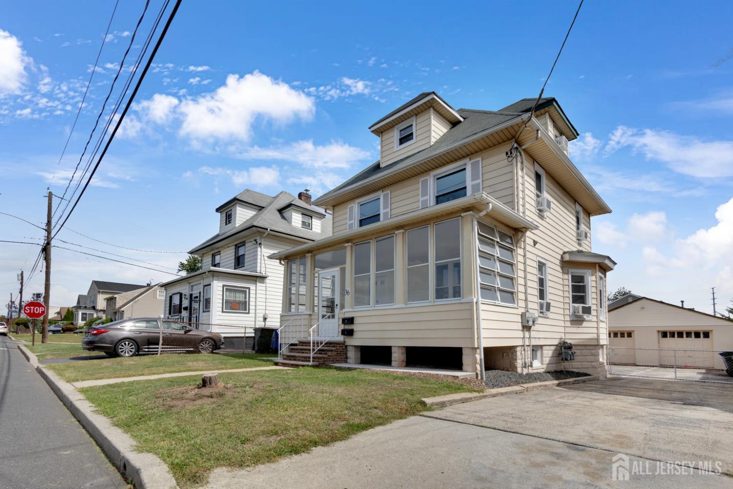 36 3rd Avenue, Unit B Port Reading, NJ 07064 - Photo 21 of 21 a front view of a house with garden