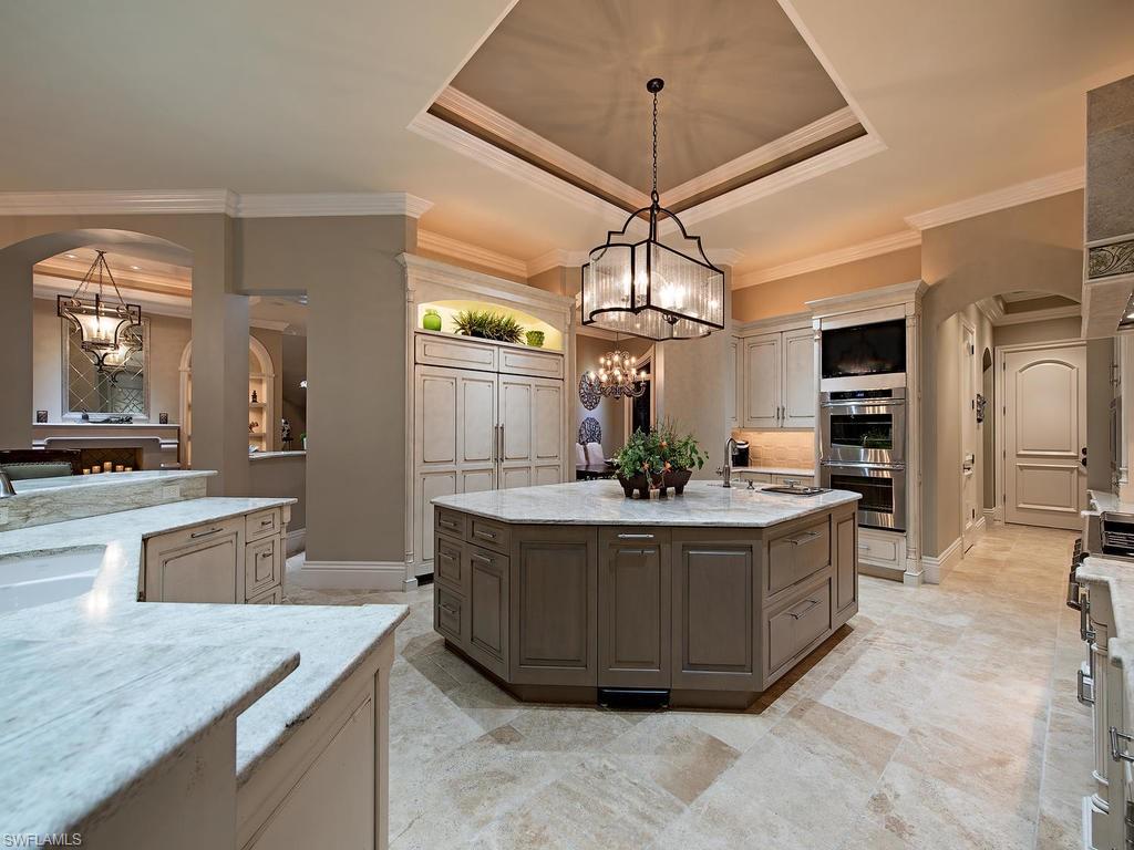 515 Riviera Drive Naples, FL 34103 - Photo 11 of 35 a living room with stainless steel appliances granite countertop furniture and chandelier