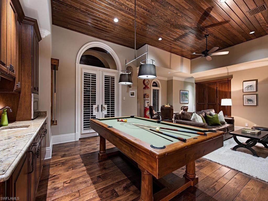 515 Riviera Drive Naples, FL 34103 - Photo 17 of 35 a very nice looking room with many windows