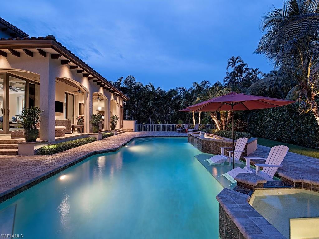 515 Riviera Drive Naples, FL 34103 - Photo 34 of 35 a view of a swimming pool with sitting area