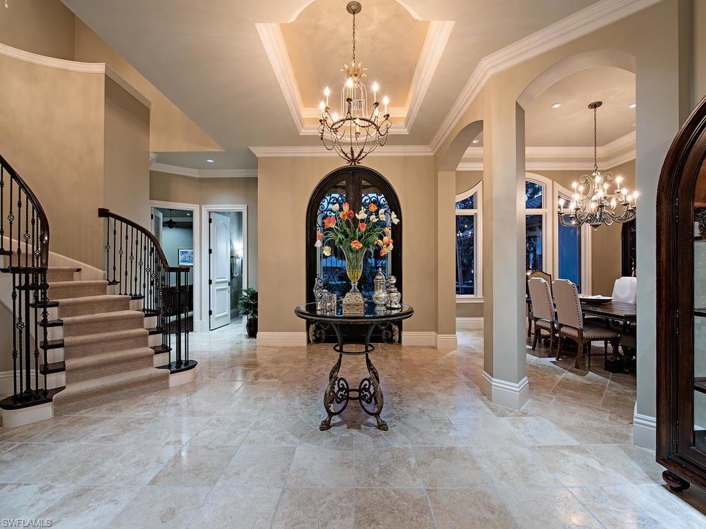 515 Riviera Drive Naples, FL 34103 - Photo 4 of 35 a view of a lobby with furniture and chandelier