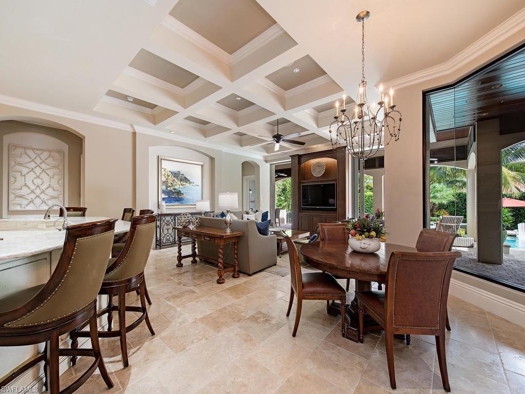 515 Riviera Drive Naples, FL 34103 - Photo 9 of 35 a view of a dining room with furniture window and outside view