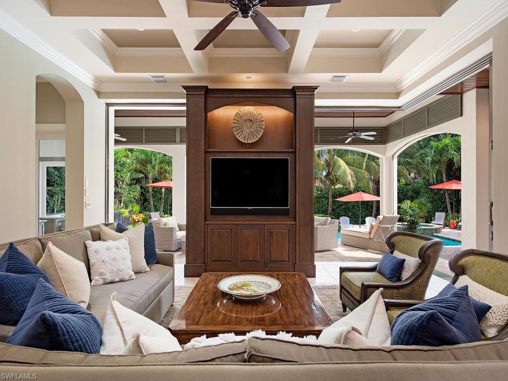 515 Riviera Drive Naples, FL 34103 - Photo 10 of 35 a living room with furniture and a flat screen tv