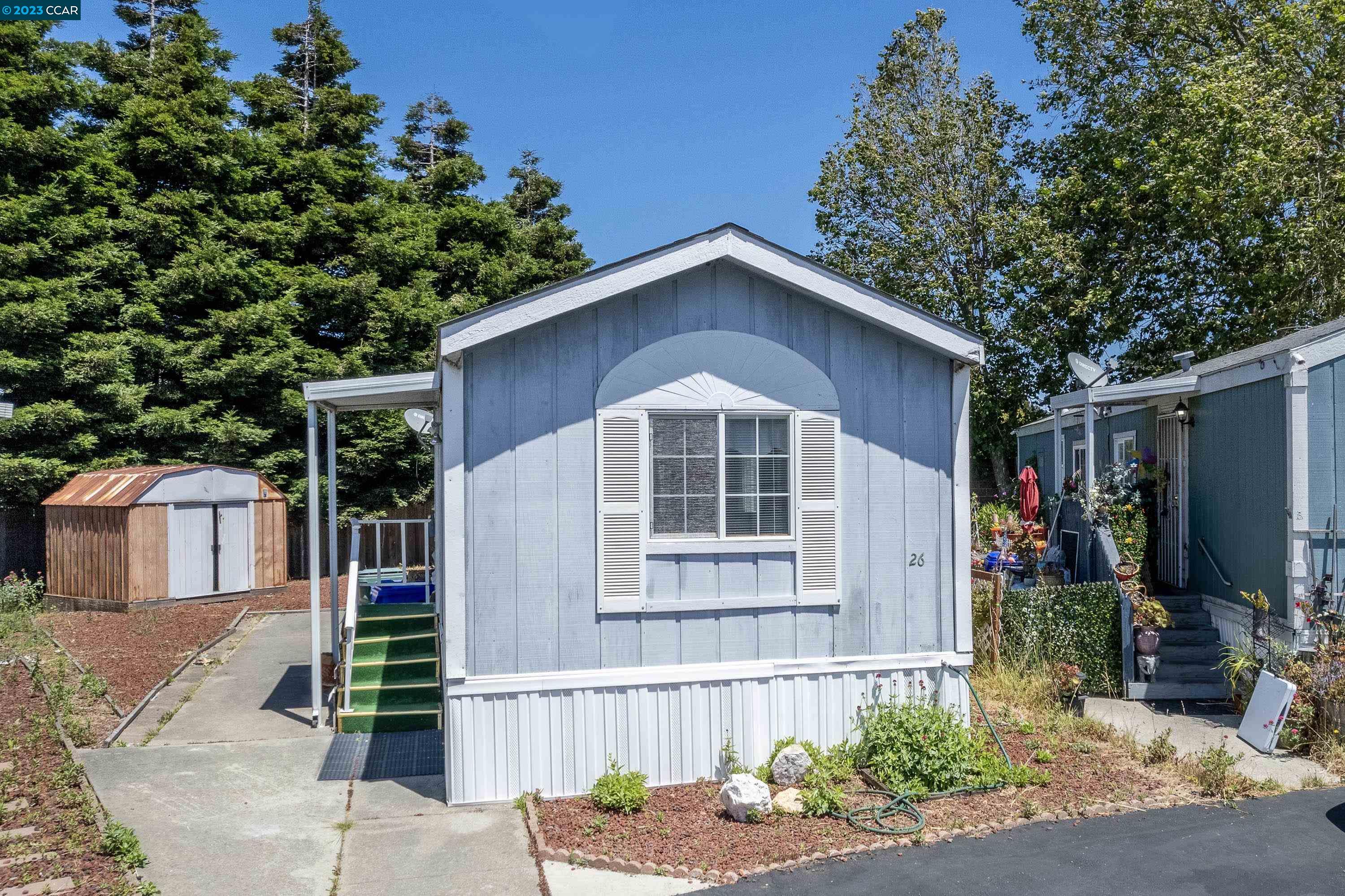2885 Willow Road, Unit 26 San Pablo, CA 94806 - Photo 1 of 1 a front view of a house with garden