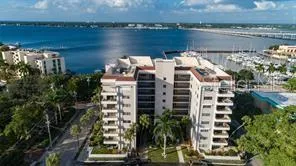 a view of a lake and tall building