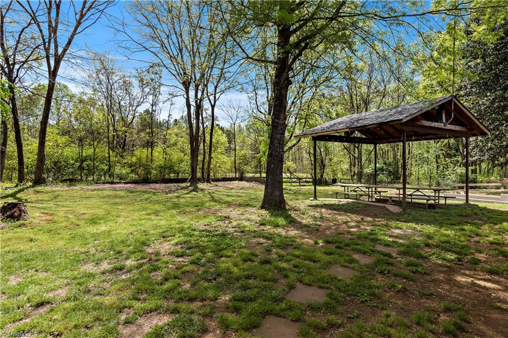 844 Rainbow Road Advance, NC 27006 - Photo 21 of 43 Spacious back yard (fence can be removed) with picnic shelter and table.