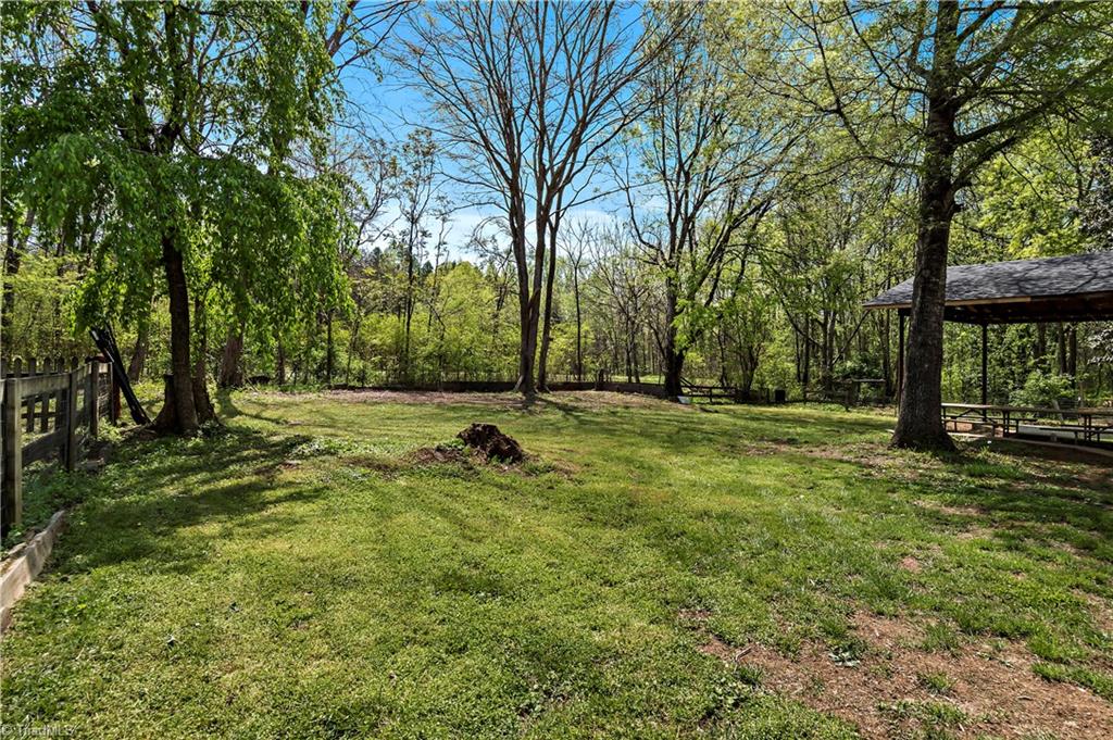 844 Rainbow Road Advance, NC 27006 - Photo 23 of 43 Spacious backyard with views of horse field behind.