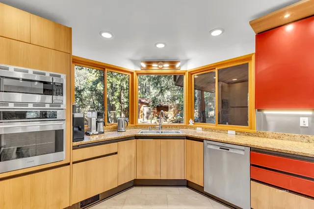 a bed room with a bed and a large window