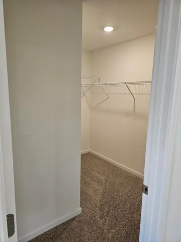 a view of a room with racks on the wall