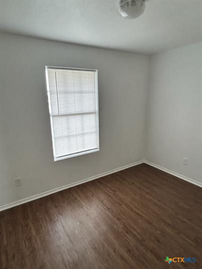 4305 Deek Drive, Unit C Killeen, TX 76549 - Photo 11 of 11 an empty room with wooden floor and windows