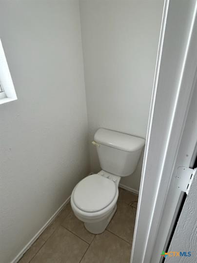 4305 Deek Drive, Unit C Killeen, TX 76549 - Photo 8 of 11 a white toilet sitting next to a white cabinet