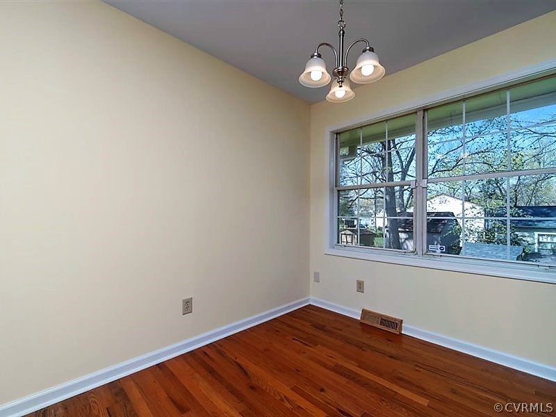 9500 Snowbird Road Chesterfield, VA 23832 - Photo 11 of 34 a view of empty room with wooden floor and fan