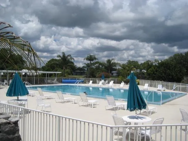 a view of a swimming pool with a patio