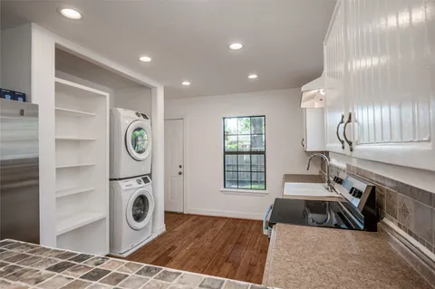 a kitchen with stove and a sink