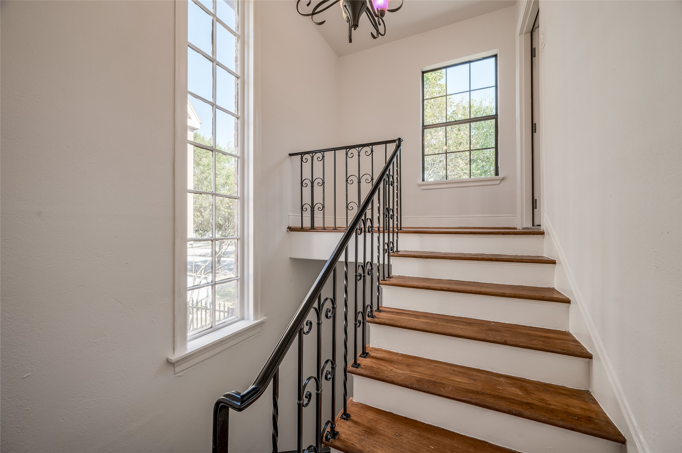 2308 Blodgett Street Houston, TX 77004 - Photo 22 of 23 an entryway with stairs and a window