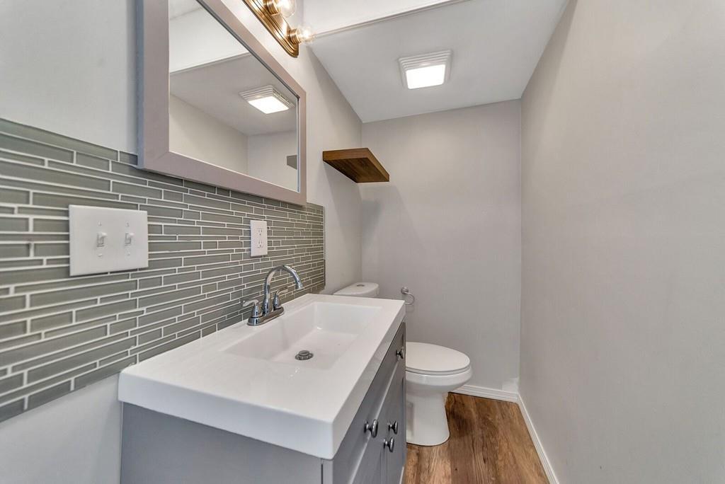 402 Allen Street Springfield, MA 01118 - Photo 14 of 28 a bathroom with a sink a toilet and mirror