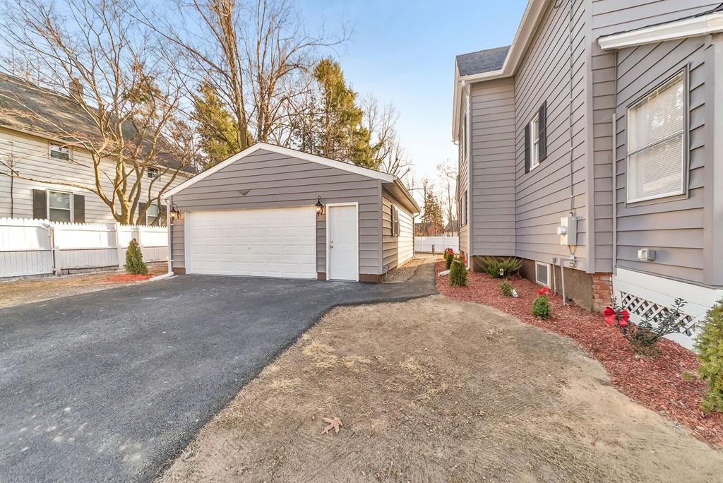 402 Allen Street Springfield, MA 01118 - Photo 2 of 28 a house view with a outdoor space