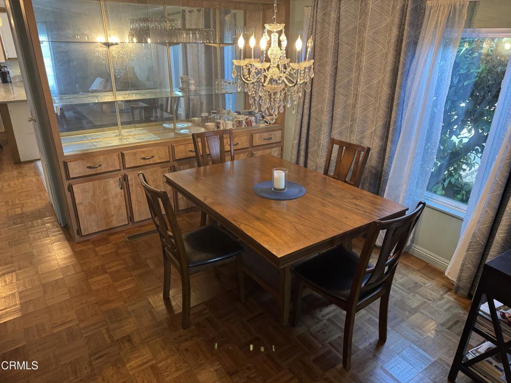 1220 Johnson Drive, Unit 131 Ventura, CA 93003 - Photo 3 of 3 a view of a dining room with furniture window and wooden floor