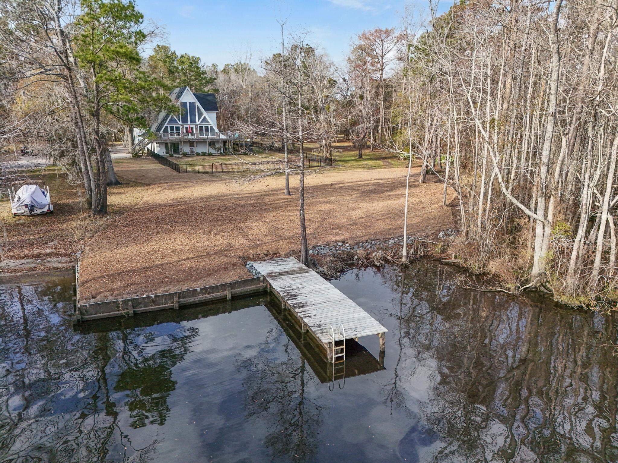 3700 Ed Smith Avenue Myrtle Beach, SC 29588 - Photo 2 of 39 Dock with a water view and view of scattered trees