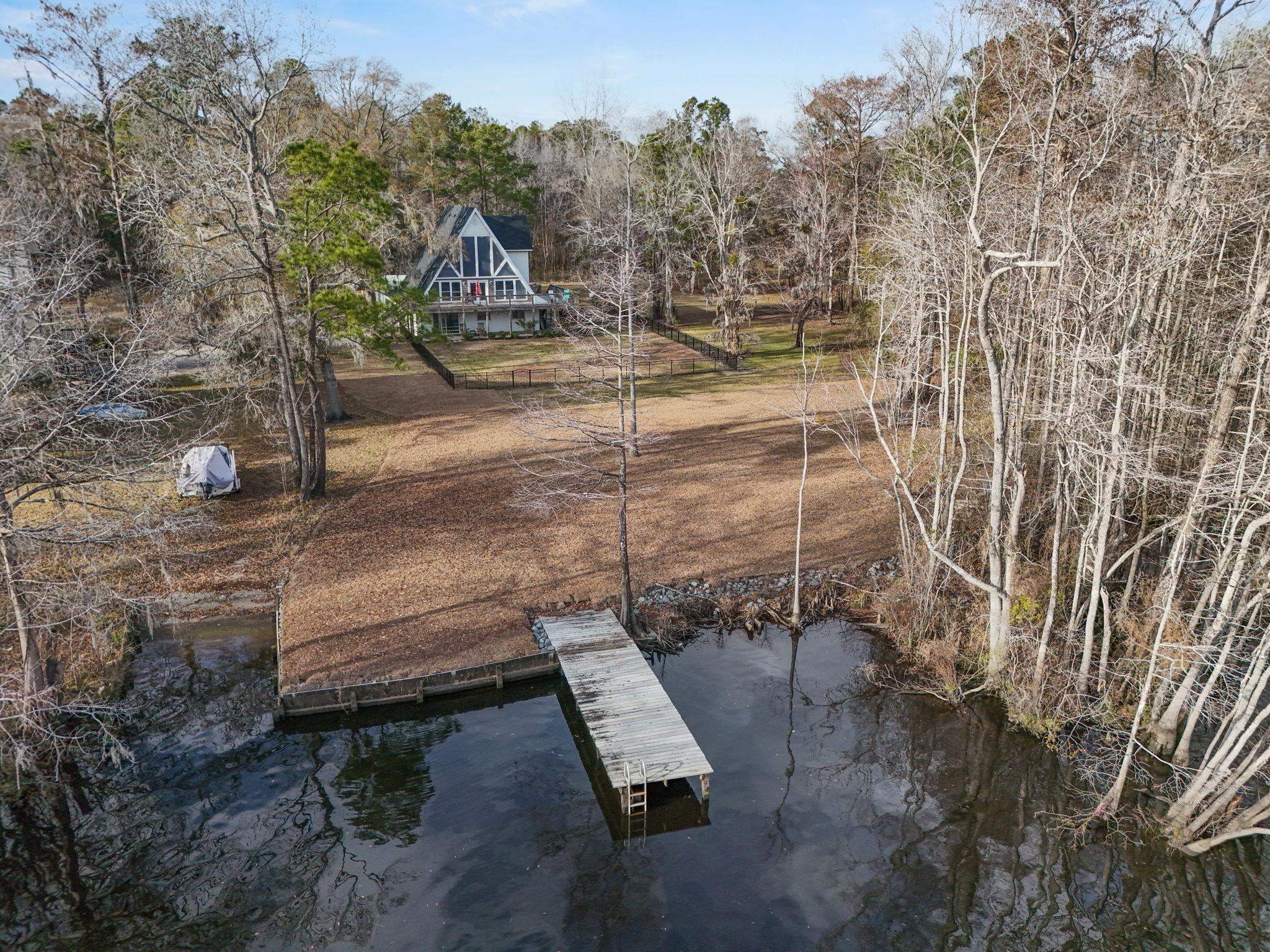3700 Ed Smith Avenue Myrtle Beach, SC 29588 - Photo 34 of 39 Dock featuring a water view and view of scattered trees