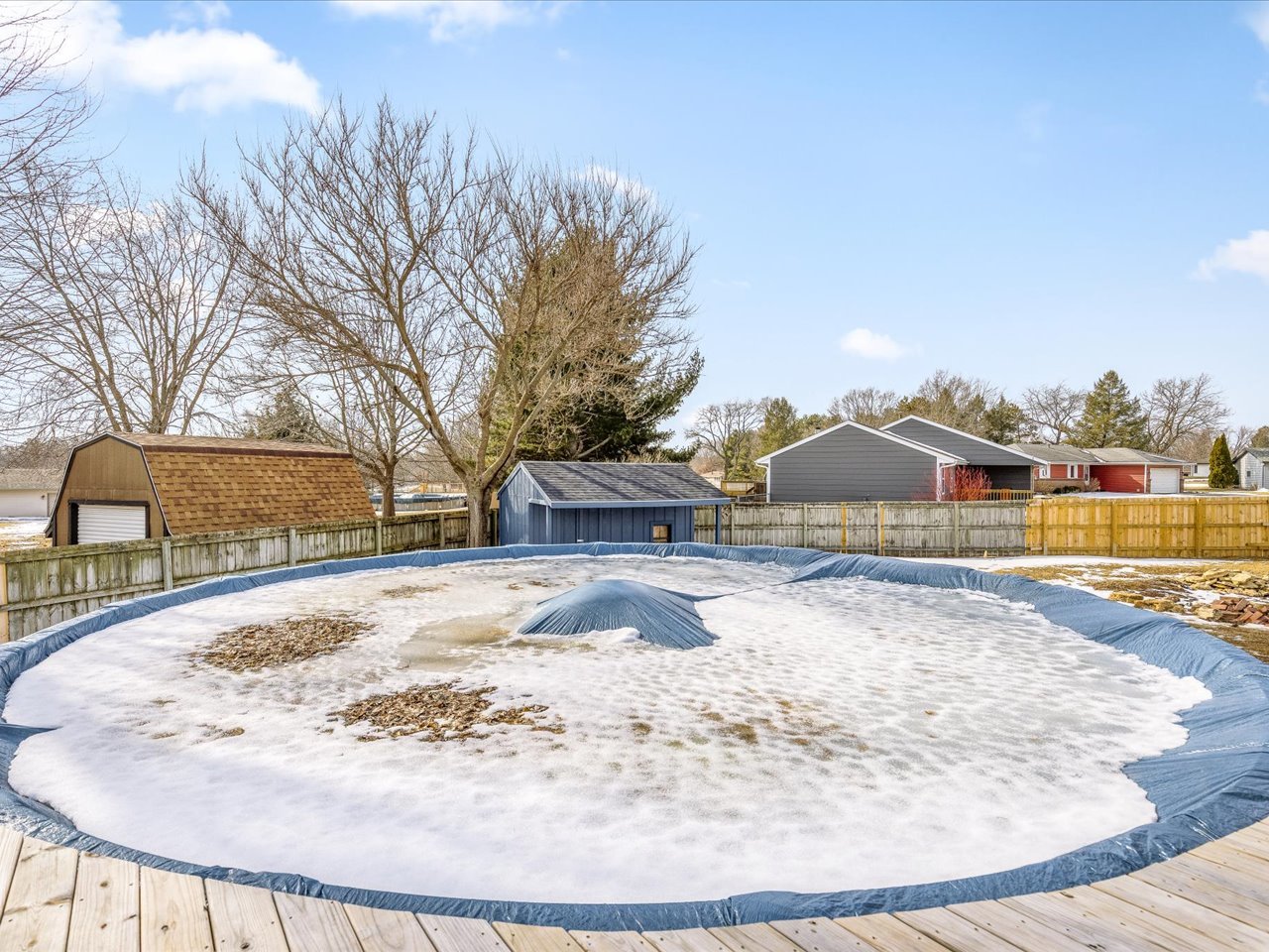 4361 Pfister Lane Roscoe, IL 61073 - Photo 33 of 41 a view of white house with a yard covered in snow