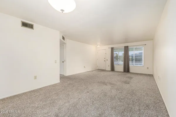 an empty room with a natural light