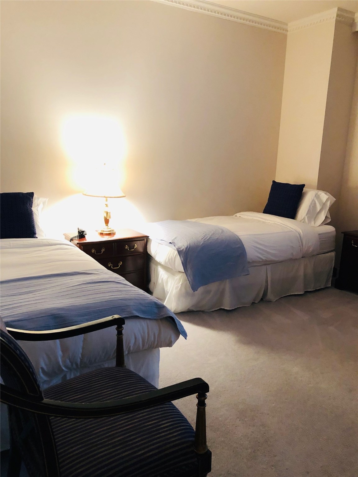 5110 San Felipe Street, Unit 273 Houston, TX 77056 - Photo 13 of 19 a bedroom with a bed and table