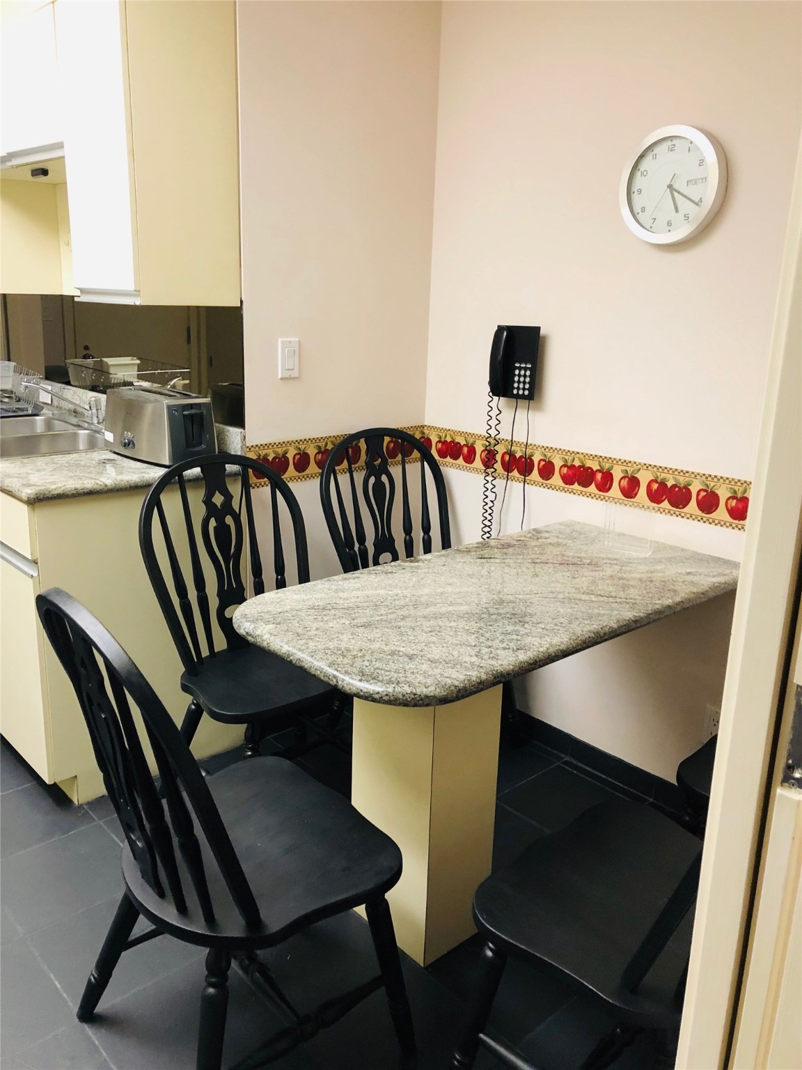 5110 San Felipe Street, Unit 273 Houston, TX 77056 - Photo 6 of 19 a view of kitchen with granite countertop and chair