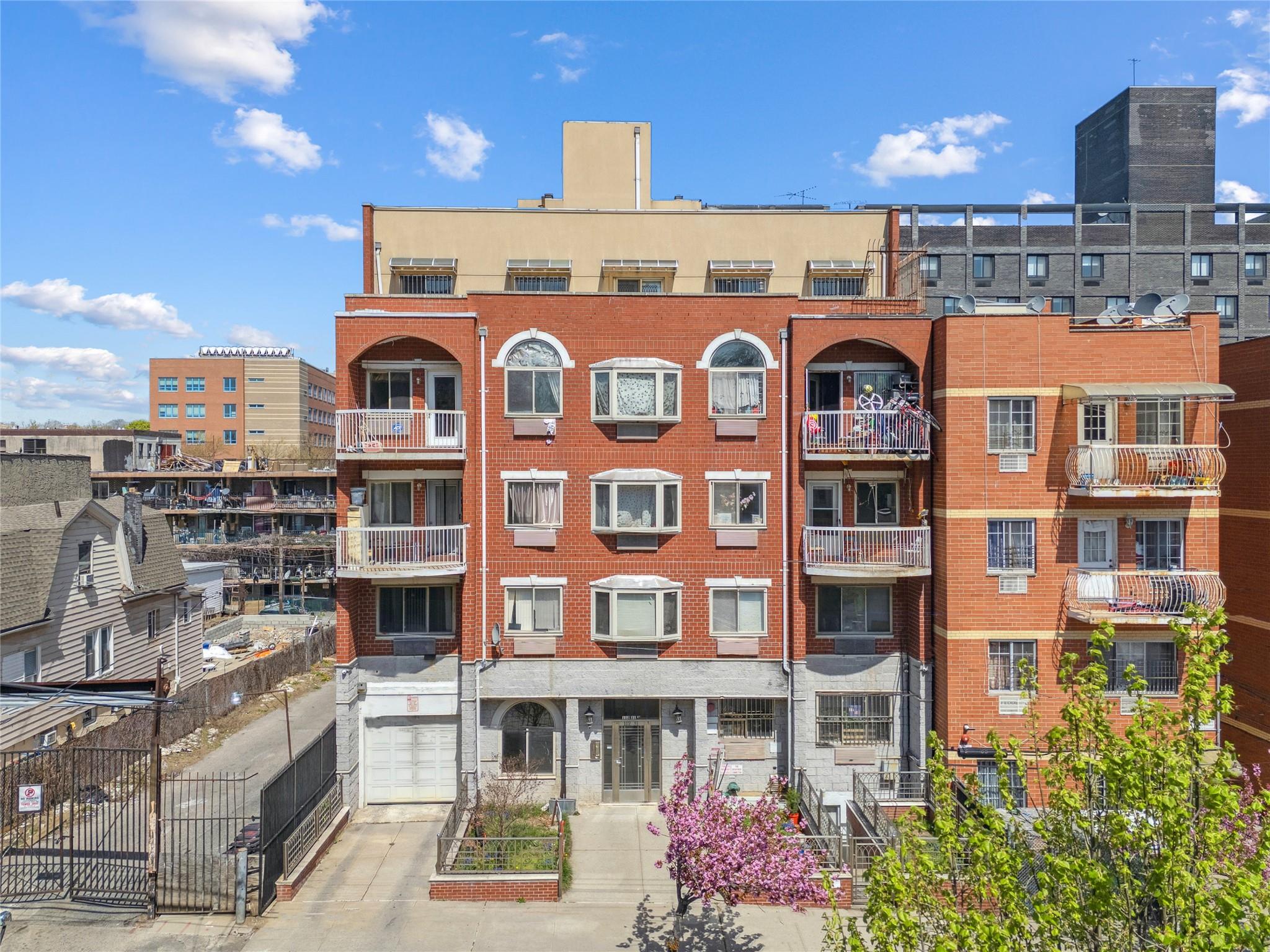 112-31 38th Avenue, Unit 5B Queens, NY 11368 - Photo 1 of 1 a front view of a multi story building