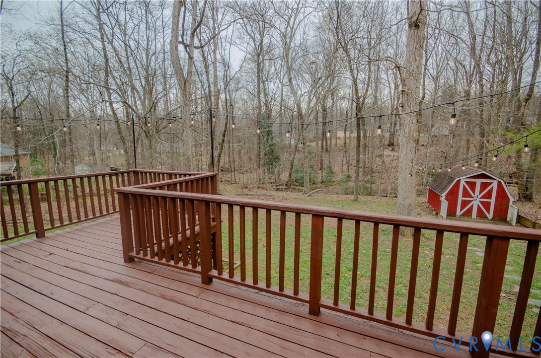 2231 Fall Line Drive Powhatan, VA 23139 - Photo 6 of 23 Deck featuring a storage shed and a yard