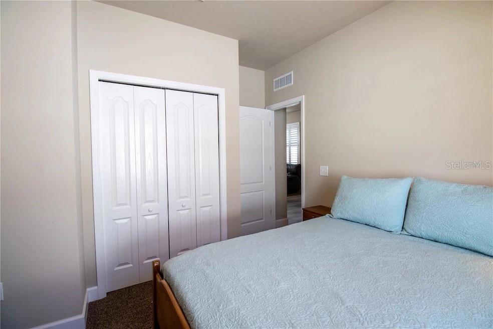 24650 Southwest 17th Place Newberry, FL 32669 - Photo 15 of 19 a bedroom with a bed and a window