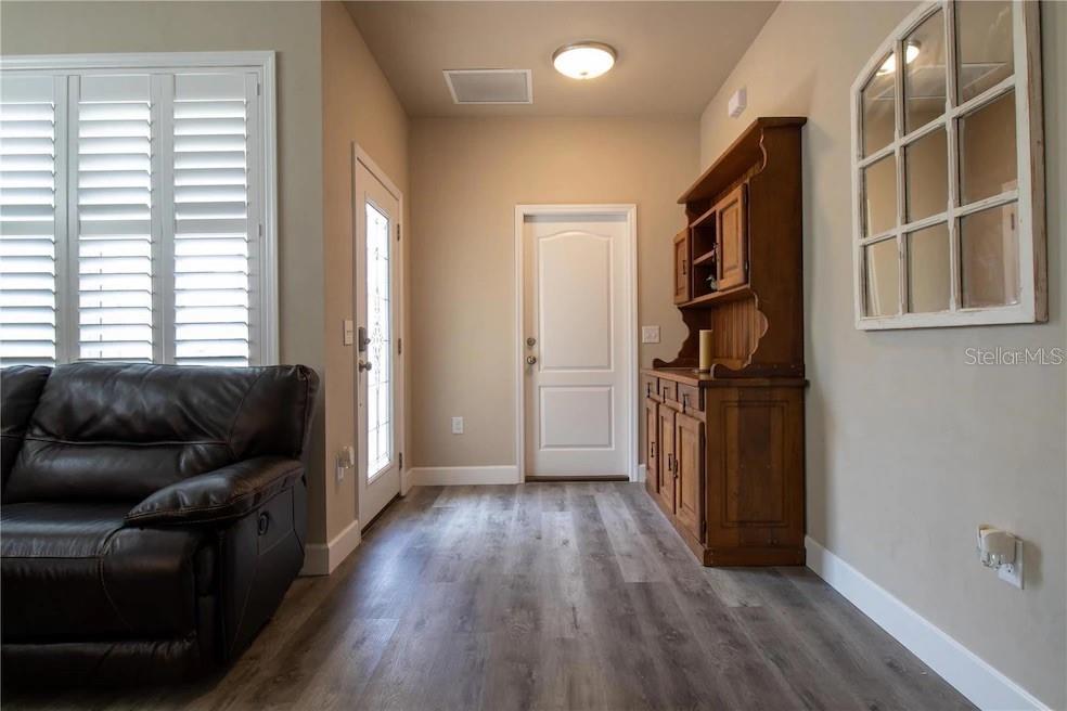 24650 Southwest 17th Place Newberry, FL 32669 - Photo 4 of 19 a living room with furniture and a window