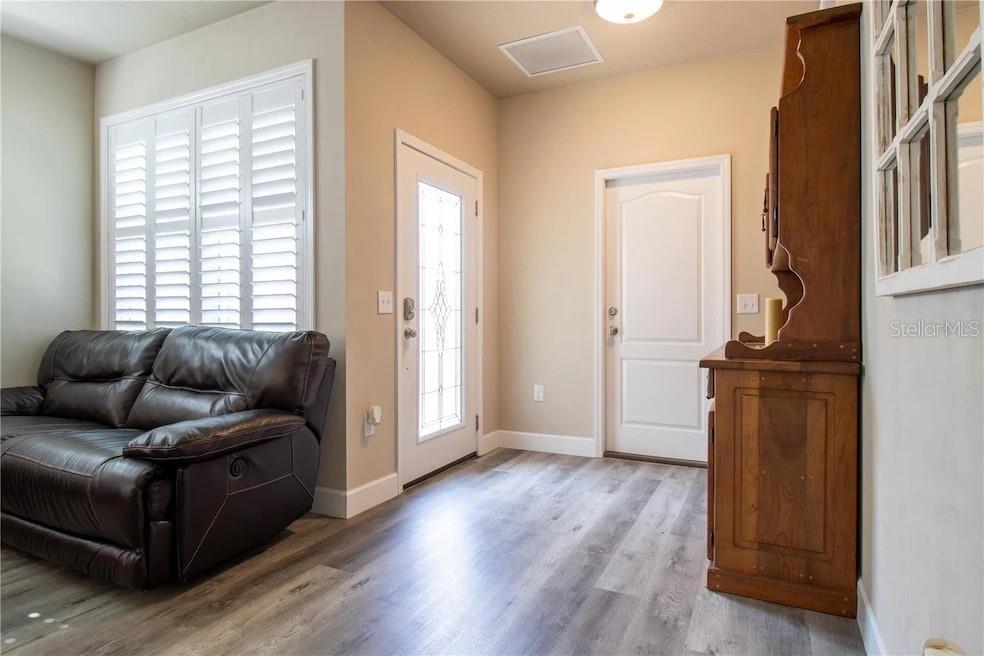 24650 Southwest 17th Place Newberry, FL 32669 - Photo 7 of 19 a living room with furniture and a window