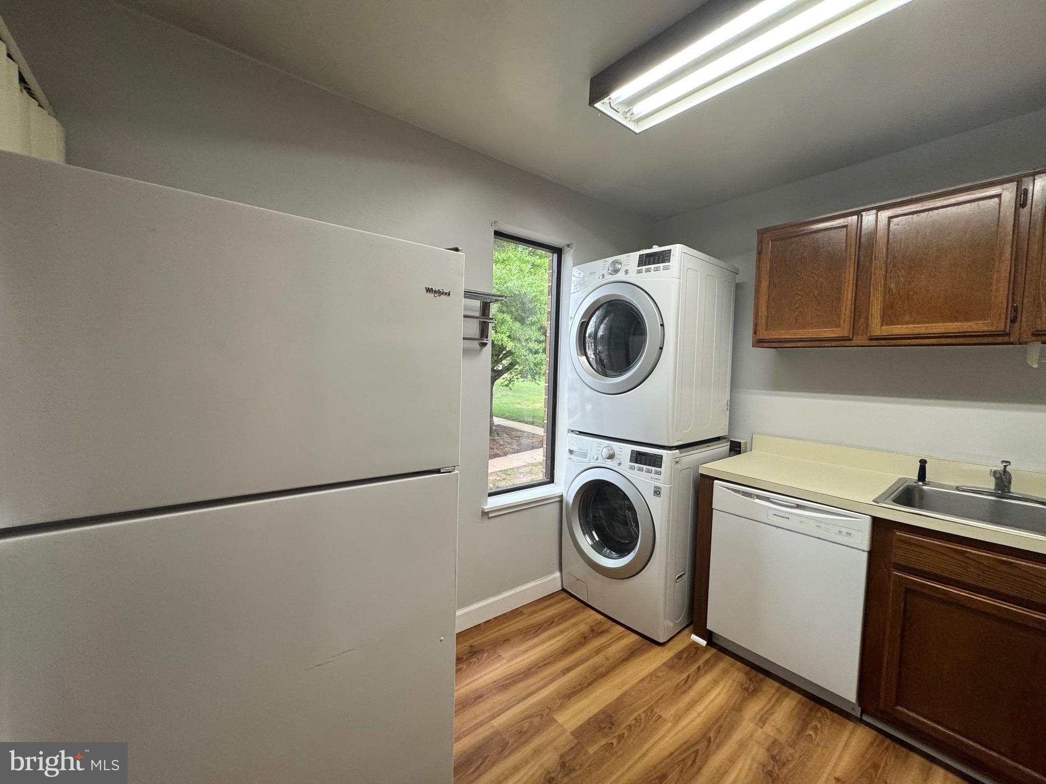 5482 Cedar Lane, Unit B2 Columbia, MD 21044 - Photo 15 of 23 a utility room with dryer and washer