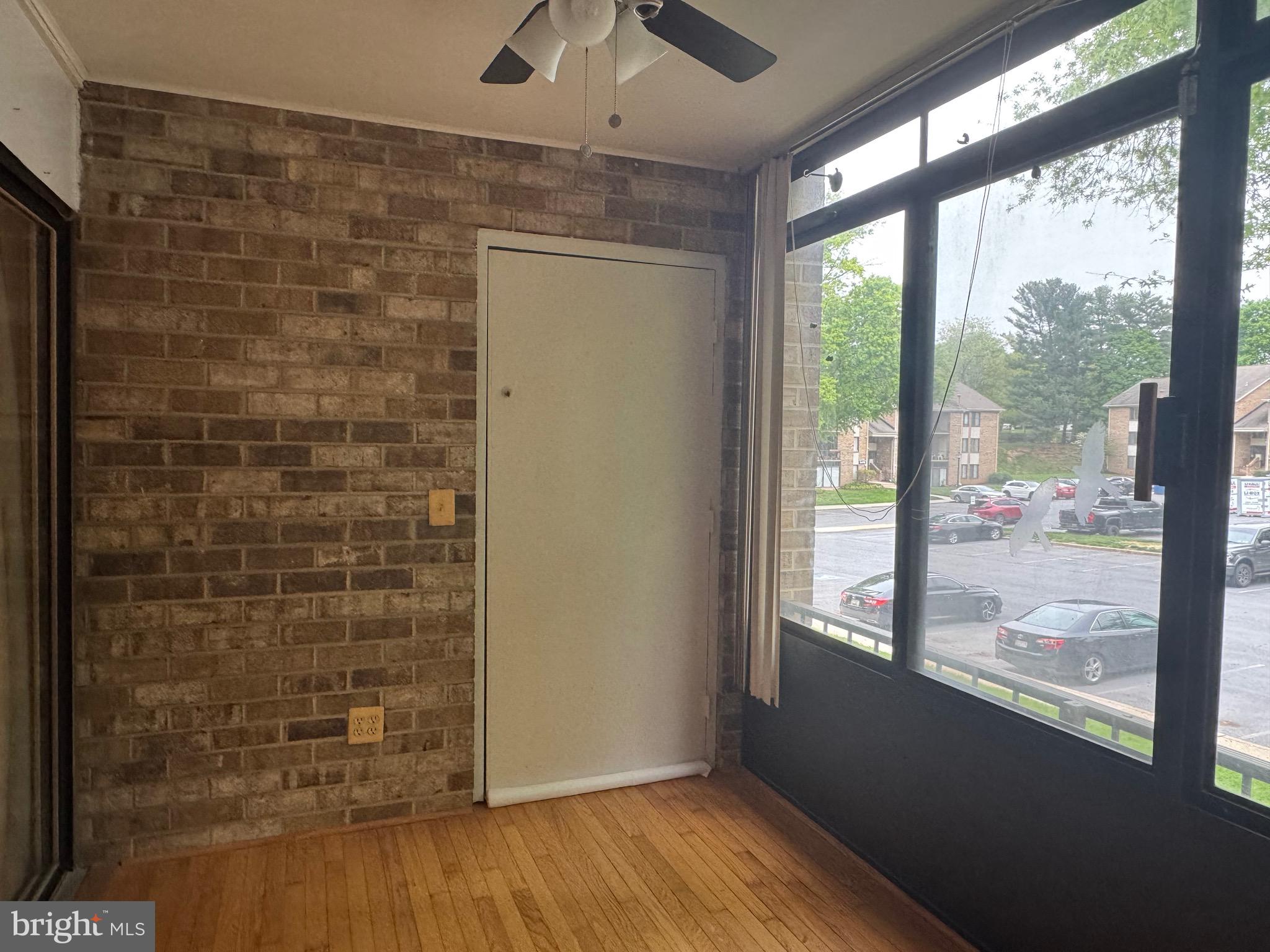 5482 Cedar Lane, Unit B2 Columbia, MD 21044 - Photo 16 of 23 a view of a hallway with wooden floor and a window