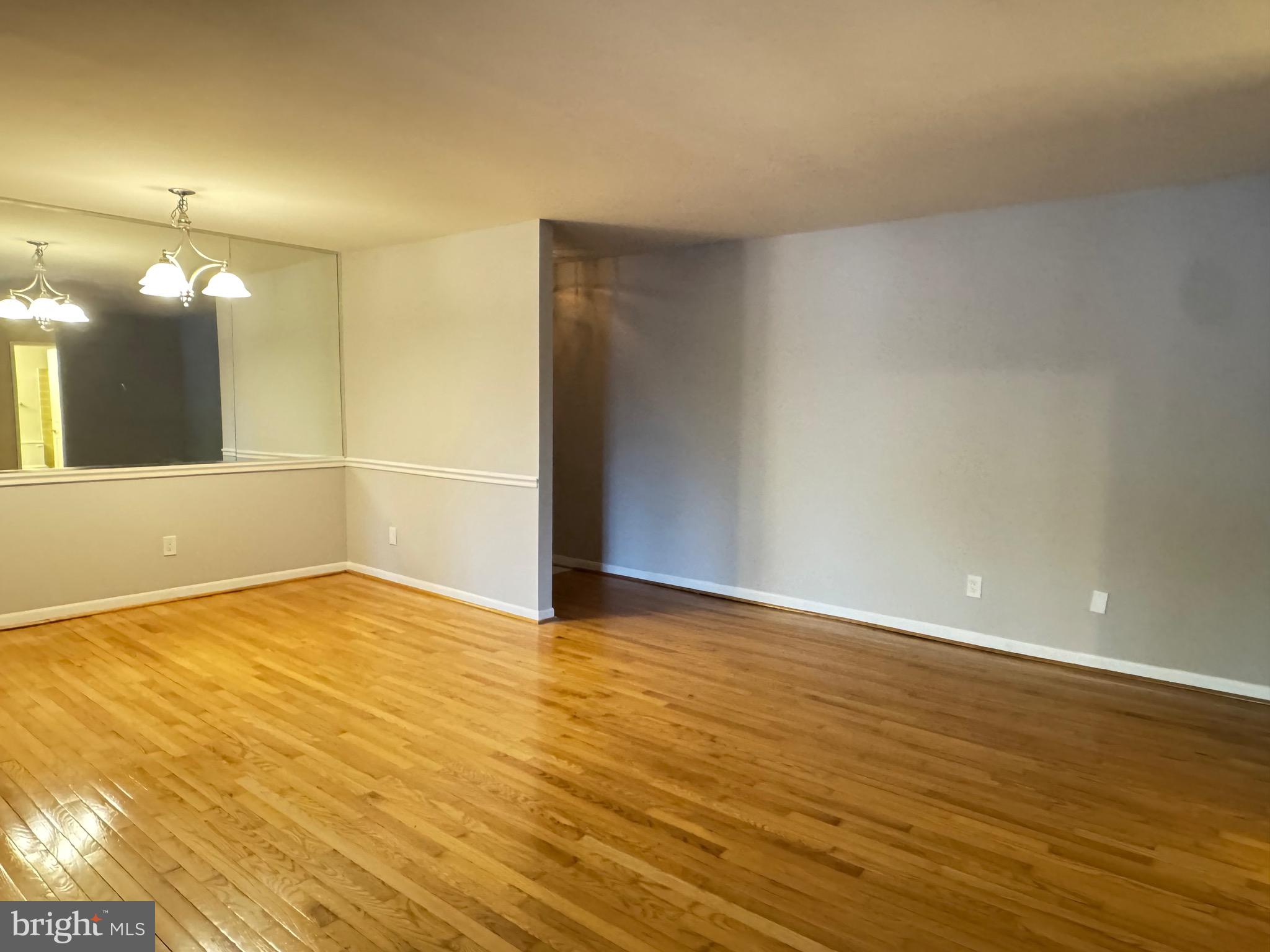 5482 Cedar Lane, Unit B2 Columbia, MD 21044 - Photo 18 of 23 a view of an empty room and wooden floor