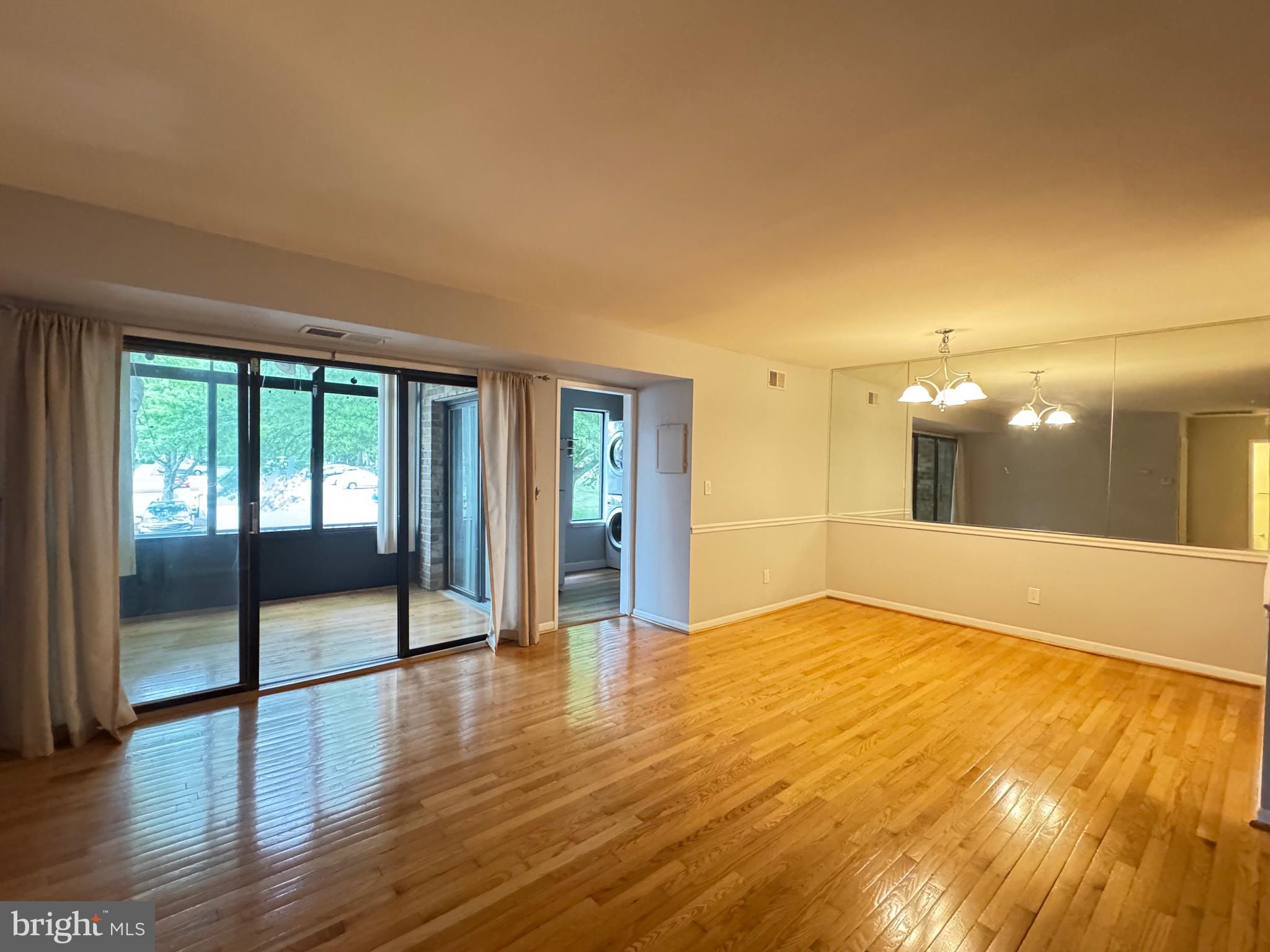 5482 Cedar Lane, Unit B2 Columbia, MD 21044 - Photo 20 of 23 a view of an empty room with glass door