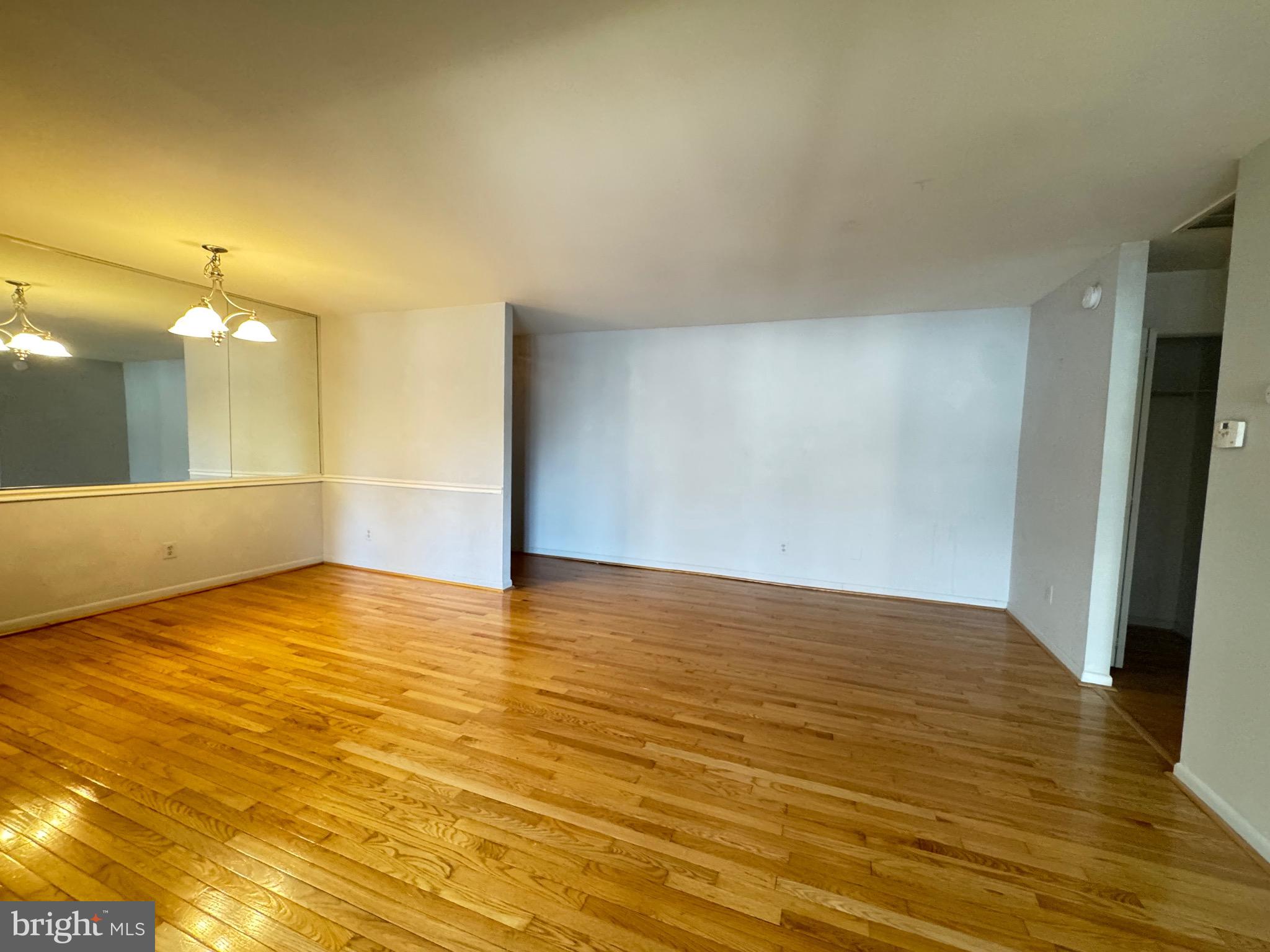 5482 Cedar Lane, Unit B2 Columbia, MD 21044 - Photo 3 of 23 a view of an empty room and wooden floor