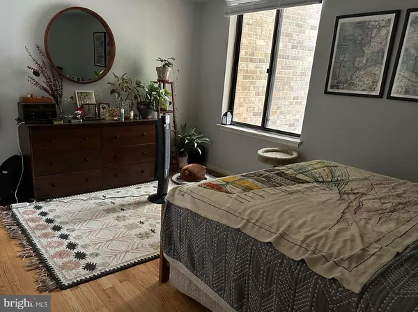 a bedroom with a bed and dresser