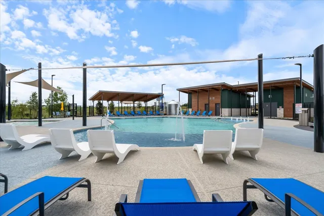 a view of swimming pool with outdoor seating